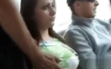 Busty brunette girl gets groped by stranger while riding the bus